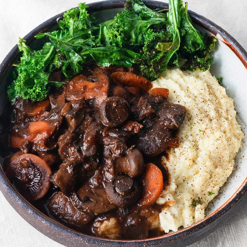 Dish photo for Slow-Cooked Mushroom Bourguignon Over Creamy Mash With Green Kale