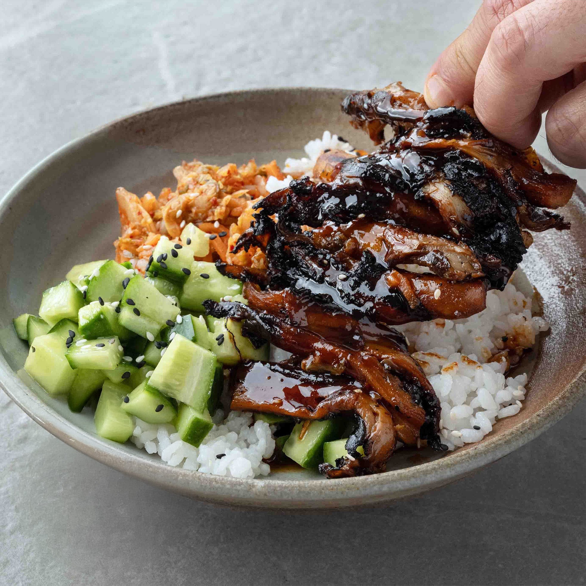 Thumbnail for Oyster Mushroom Bulgogi Bowl With Sticky Sushi Rice, Kimchi, Cucumber Salad & Toasted Sesame Seeds