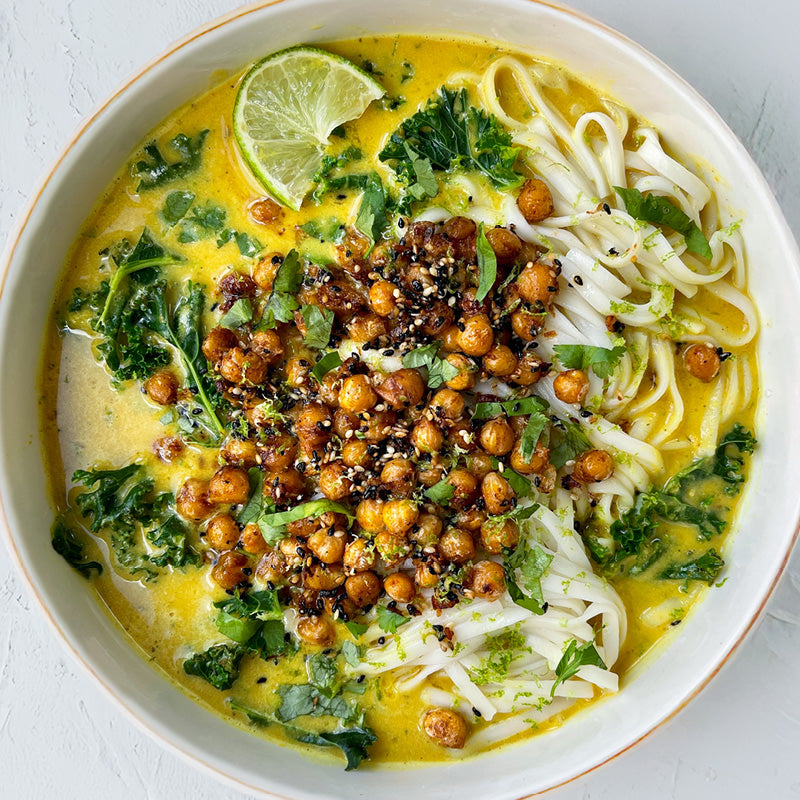 Dish photo for Curried Squash Noodle Soup With Rice Noodles, Crispy Coconut Chickpeas & Fresh Green Kale