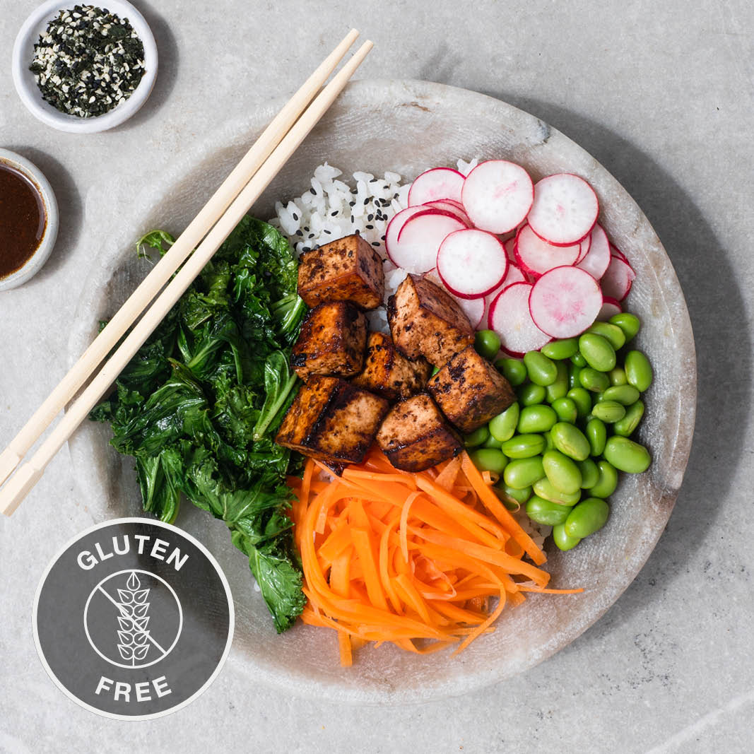 Dish photo for Rainbow Poke Bowl With Miso Glazed Tofu, Pickled Carrot, Crispy Kale, Edamame, Tamari Miso Dressing & Furikake