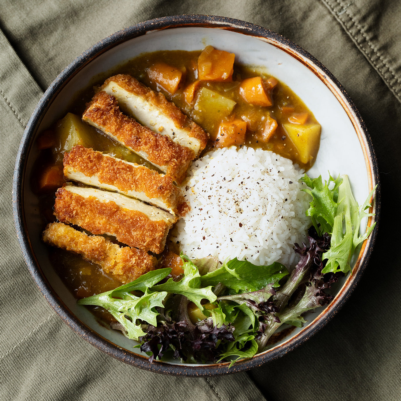 Dish photo for Crispy Tofu Katsu Curry With Sticky Rice & Seasonal Mixed Leaves In Sweet Miso Dressing