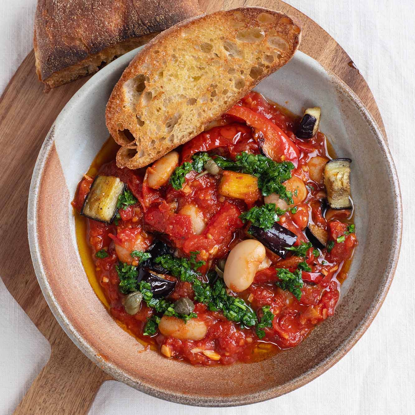 Thumbnail for Butter Bean Caponata With Roasted Peppers & Aubergine, Salsa Verde & Warm Ciabatta