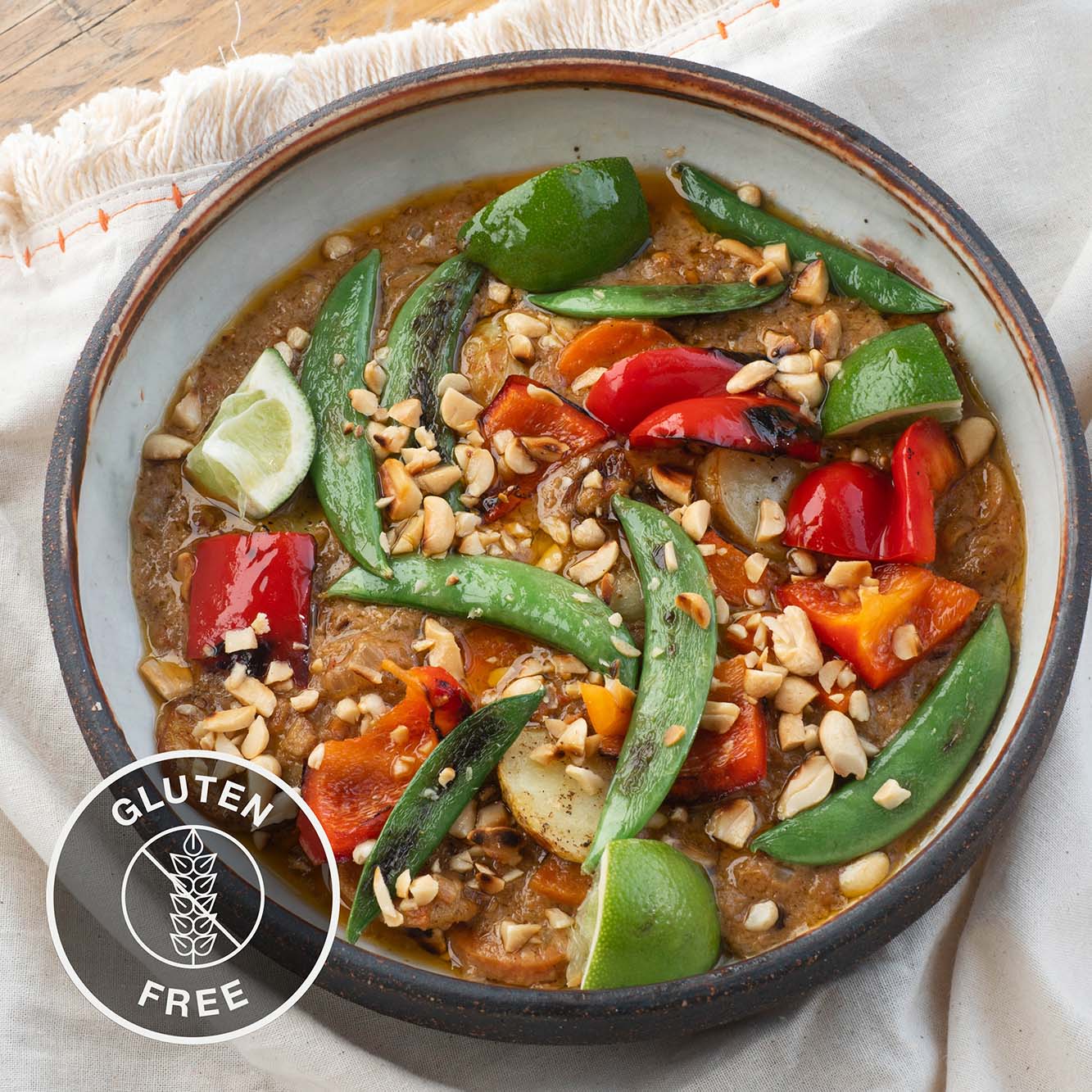 Dish photo for Peanut Butter Curry With Charred Red Peppers, Sugar Snap Peas, Lime & Toasted Peanuts