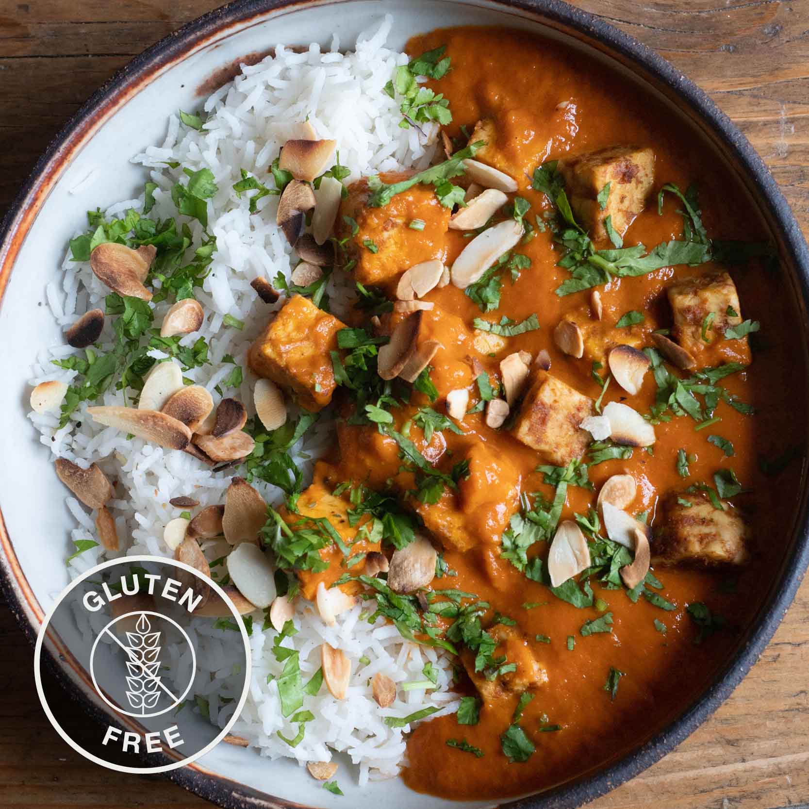 Dish photo for Rich & Creamy Tempeh Tikka Masala With Toasted Flaked Almonds, Fresh Coriander & Basmati Rice