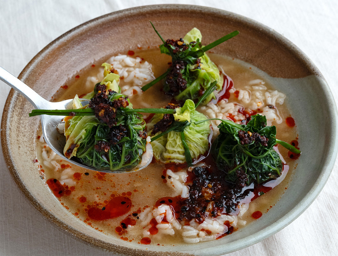 Dish photo for Savoy Cabbage Dumplings With Garlic Ginger Miso Brothy Rice & Umami Chilli Crisp Drizzle