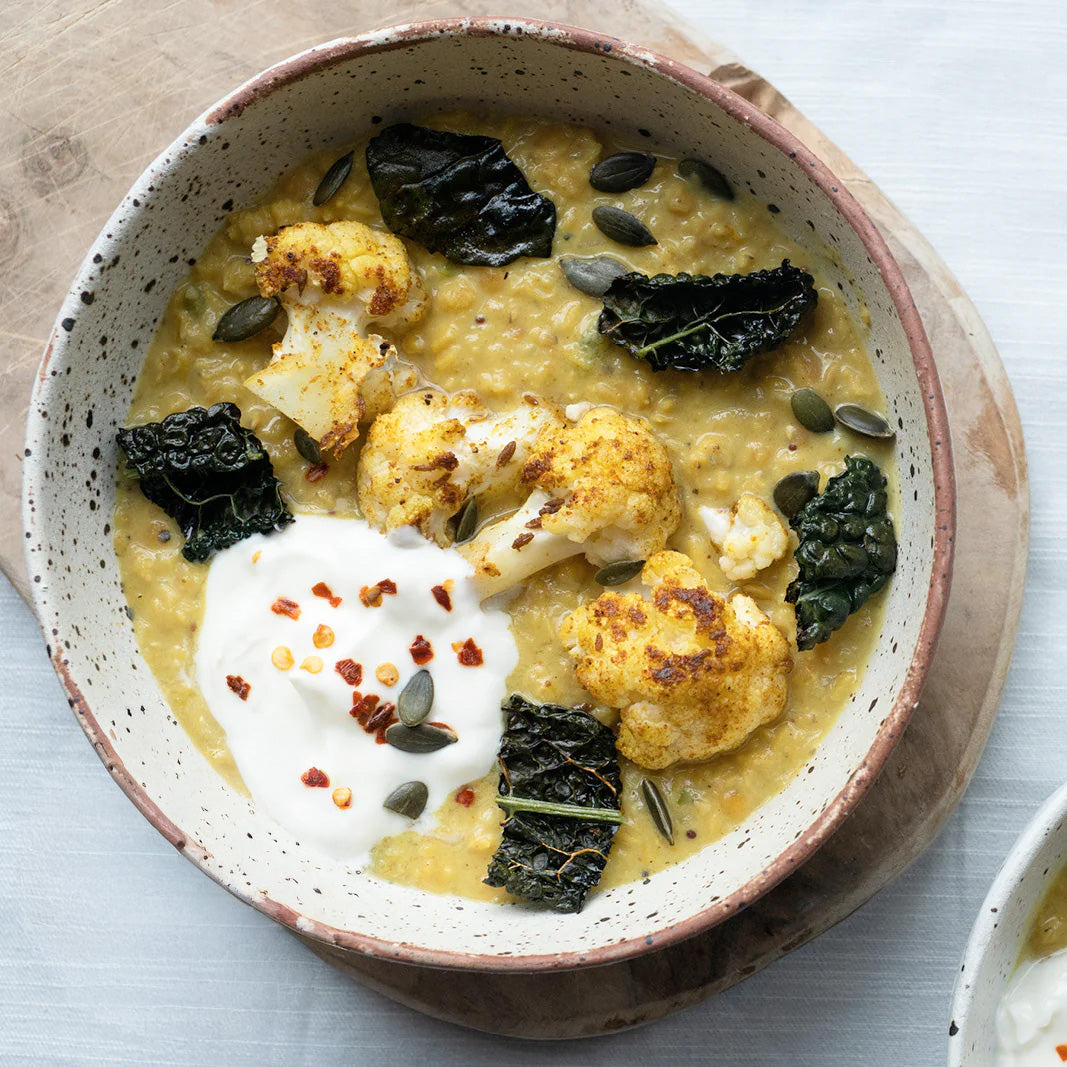 Dish photo for Creamy Coconut Daal With Spice Roasted Cauliflower, Crispy Kale & Coconut Yoghurt