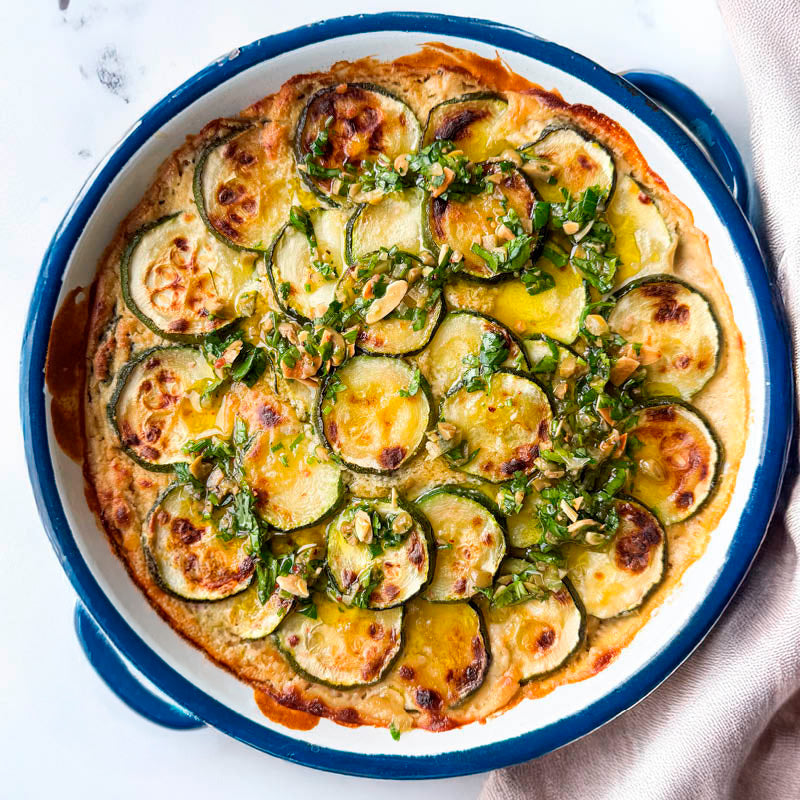 Dish photo for Courgette Gratin With Cashew Cheese Sauce, Creamy Cannellini Beans And Olive & Almond Gremolata