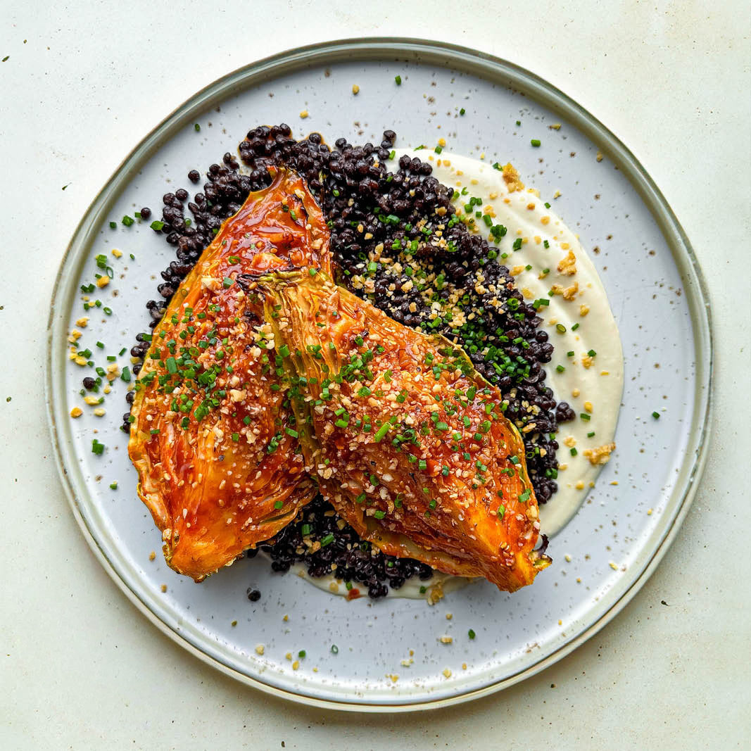Thumbnail for Charred Gochujang Glazed Hispi Cabbage Over Lime Tahini Yoghurt With Lentils & Orange Peanut Crumb