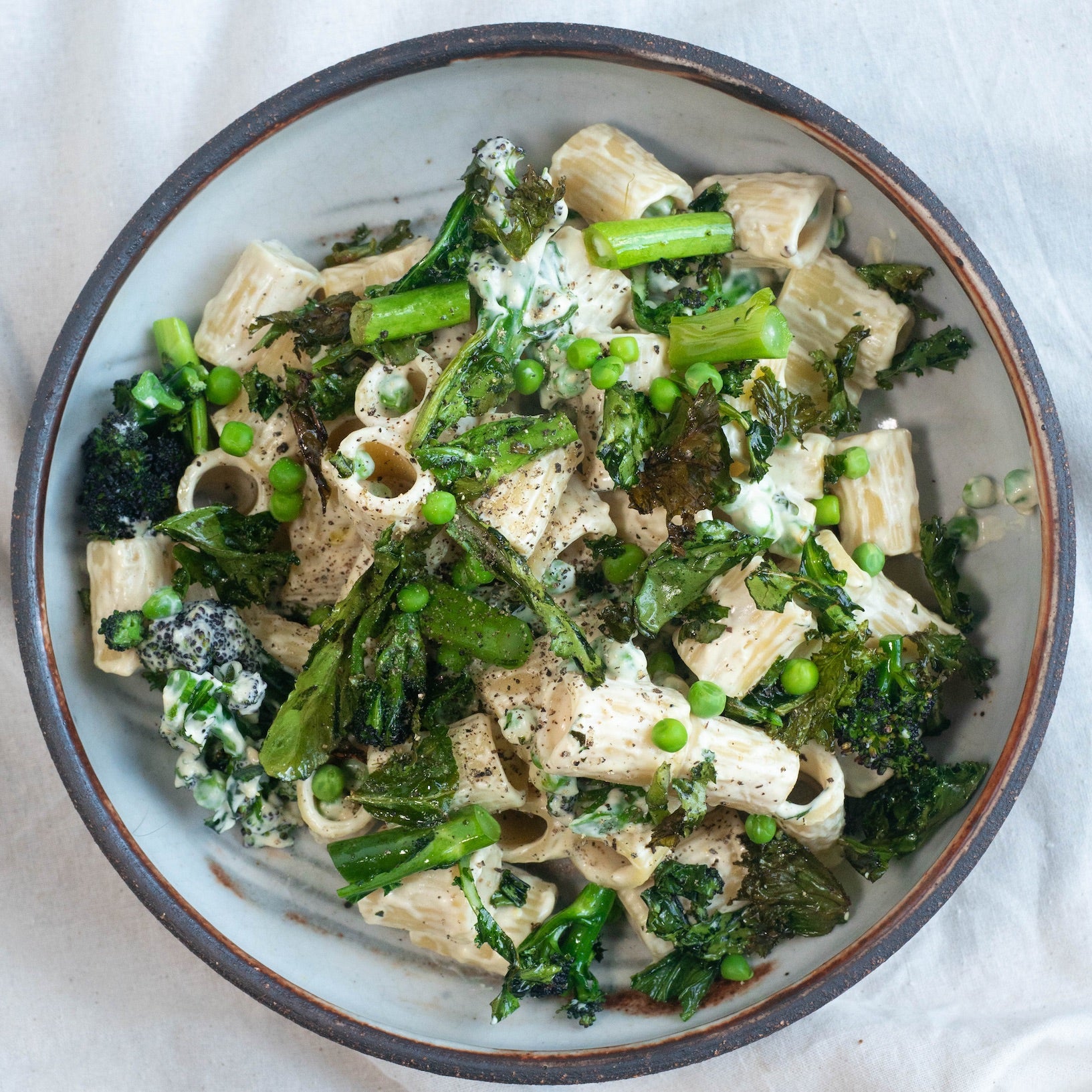 Dish photo for Mac & Greens With Tenderstem Broccoli, Crispy Kale & Mezzi Rigatoni In A Creamy Cashew Sauce