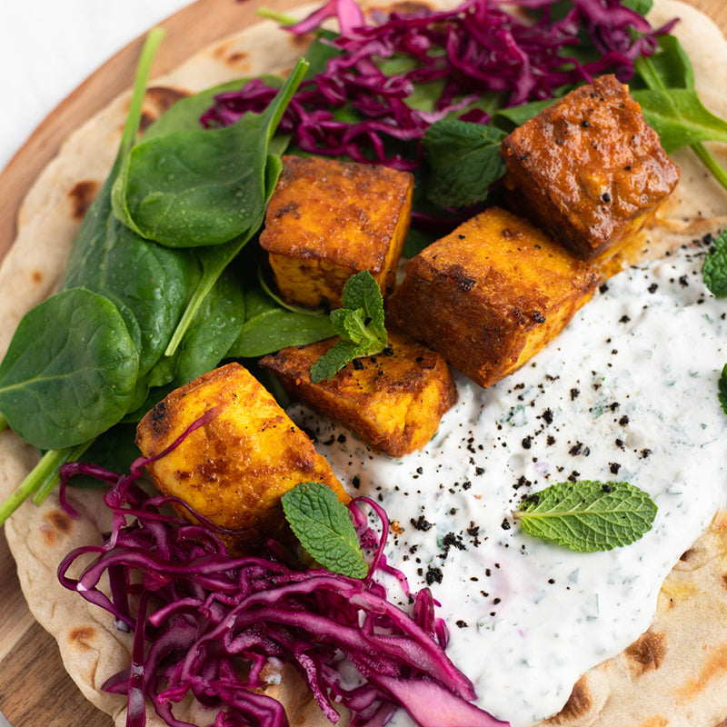 Dish photo for Tandoori Tofu Naan Wraps With Cooling Mint Yoghurt, Pickled Red Cabbage & Fresh Spinach