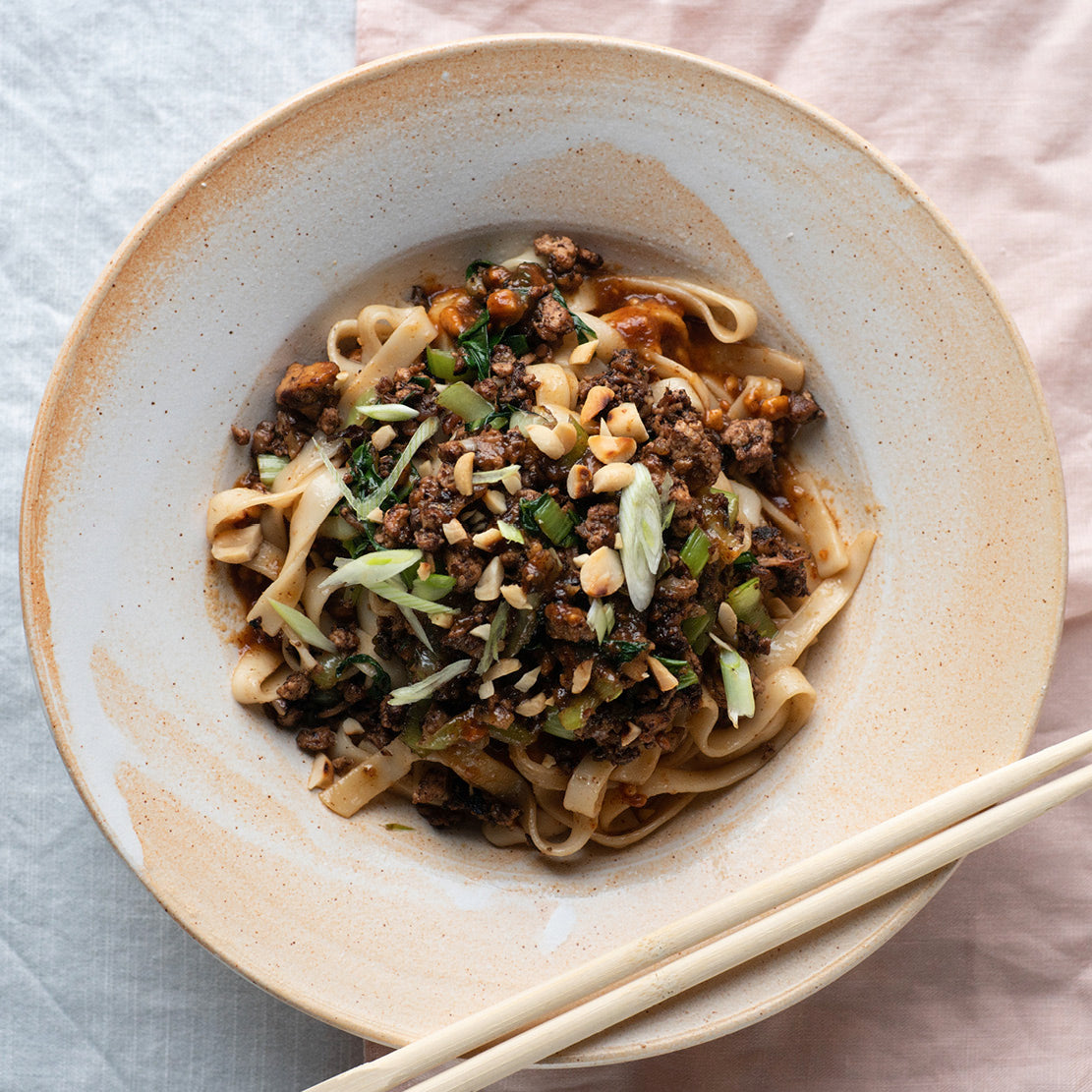Dish photo for Dan Dan Noodles With Miso Mushrooms, Chilli Garlic Peanut Sauce, Toasted Nuts & Spring Onions