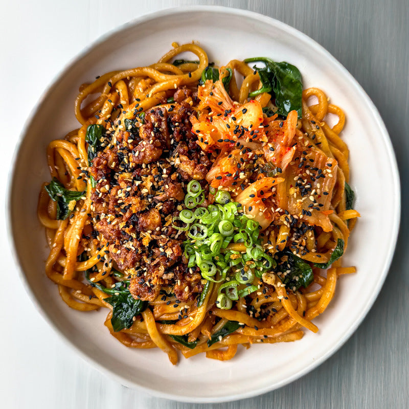 Dish photo for Kimchi Stir Fried Noodles With Crispy Tempeh Mince, Cabbage, Carrot, Spring Onions & Sesame Gochugaru Crunch