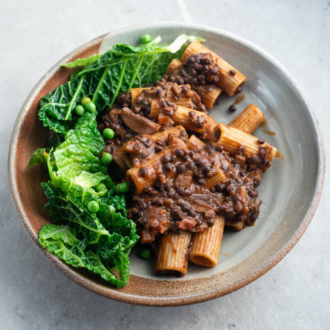 Dish photo for Rich Porcini Lentil Ragu Over Wholewheat Rigatoni With Savoy Cabbage & Garden Peas