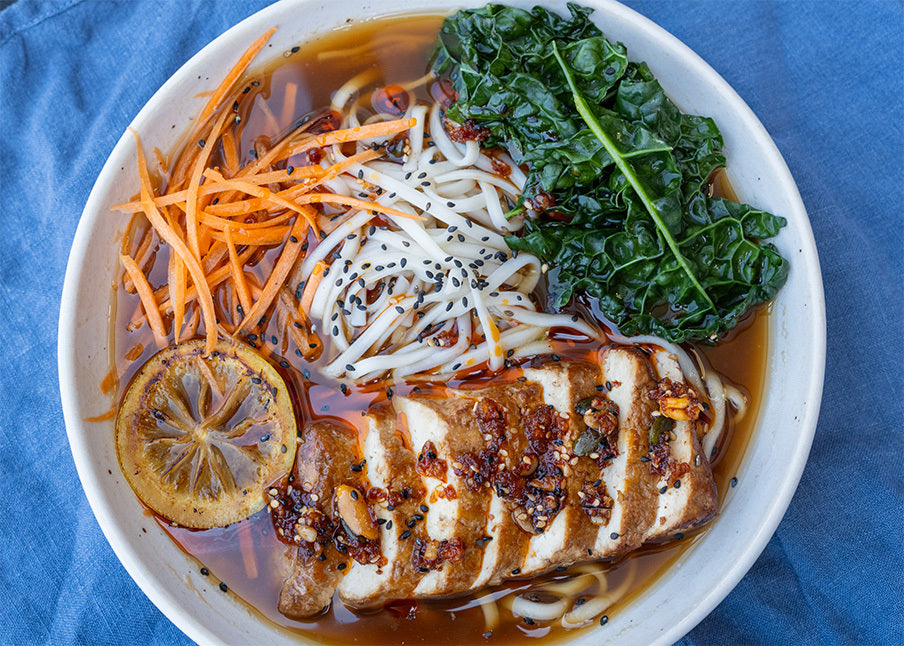 Dish photo for Lemon & Ginger Detox Ramen With Smoked Tofu, Udon Noodles, Cavolo Nero, Carrot & Superseed Chilli Crunch