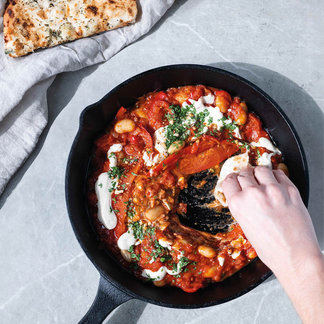 Dish photo for Sweet & Smoky Butter Bean Shakshuka With Whipped Tahini, Toasted Dukkah & Soft Garlic Flatbread