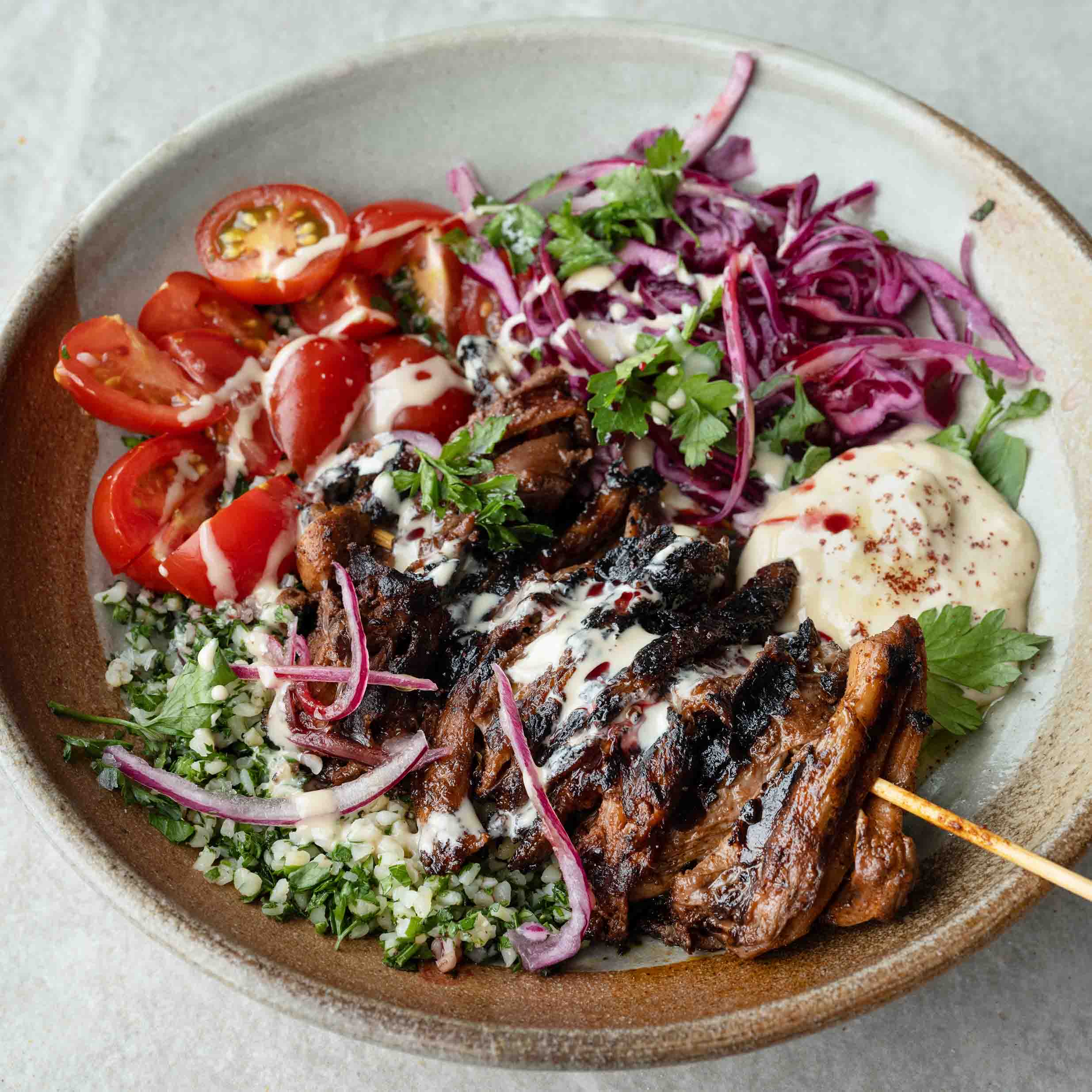 Dish photo for Oyster Mushroom Shawarma Bowl With Bulgar Tabbouleh, Hummus, Sumac Pickled Cabbage, Cherry Tomatoes & Tahini Sauce