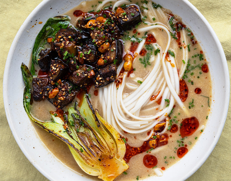Dish photo for Tahini Miso Udon Noodle Soup With Sweet & Smoky Chilli Glazed Aubergine, Pak Choi & Chives