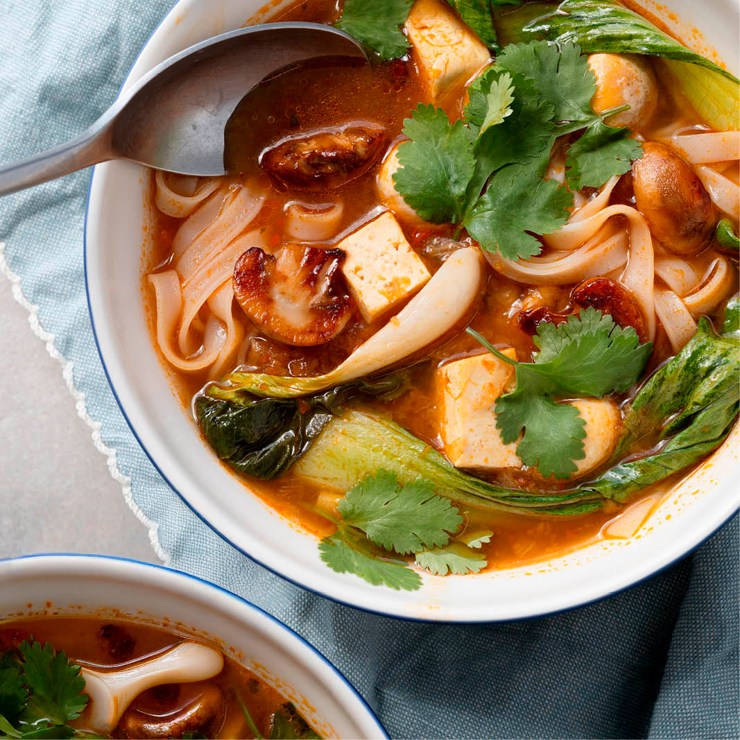 Dish photo for Fragrant Thai Tom Yum Noodle Soup With Tofu, Pak Choi, Button Mushrooms, Coriander & Lime