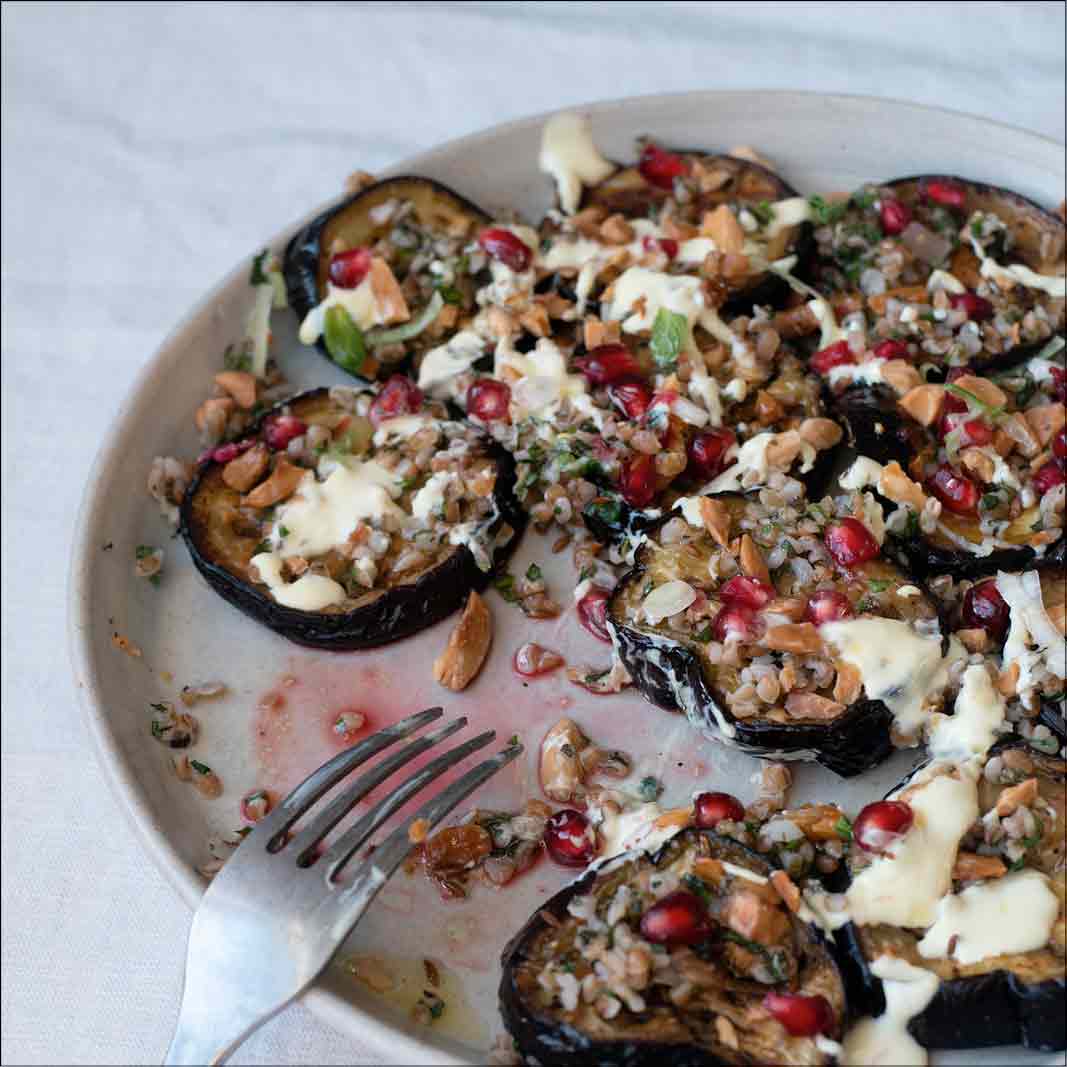 Dish photo for Middle Eastern Spiced Aubergine With Bulgar, Saffron Yoghurt, Toasted Almonds & Pomegranate