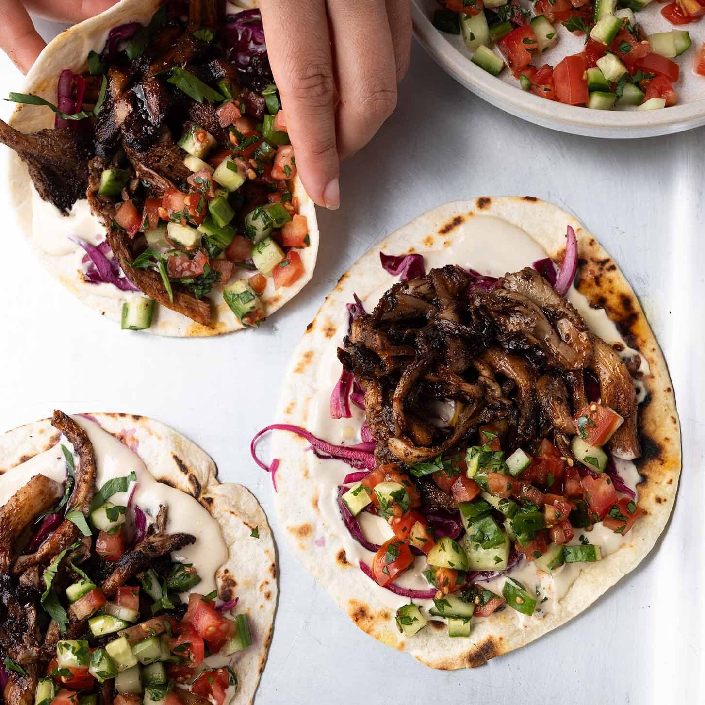 Thumbnail for Oyster Mushroom Shawarma Tacos With Garlic Tahini Sauce, Chopped Shirazi Salad & Sumac Pickled Onions