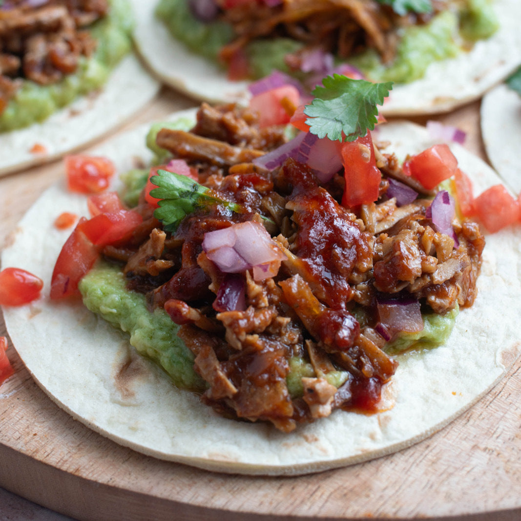 Dish photo for Pulled Tofu Tacos In Guajillo Adobo Sauce With Guacamole & Pico De Gallo On Soft Tortillas