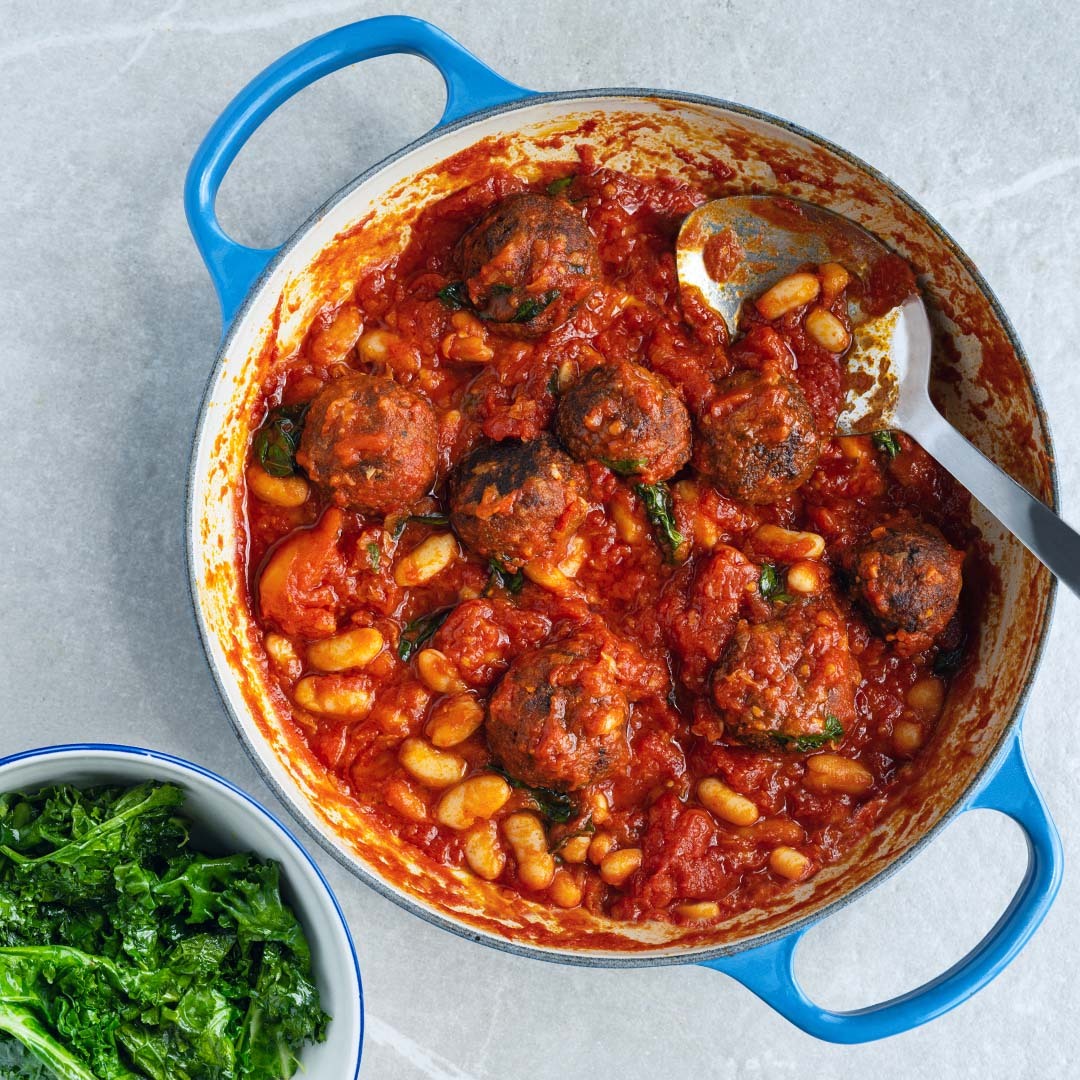 Dish photo for High Protein Tempeh Meatballs In Smoky Tomato Sauce With Cannellini Beans & Braised Green Kale