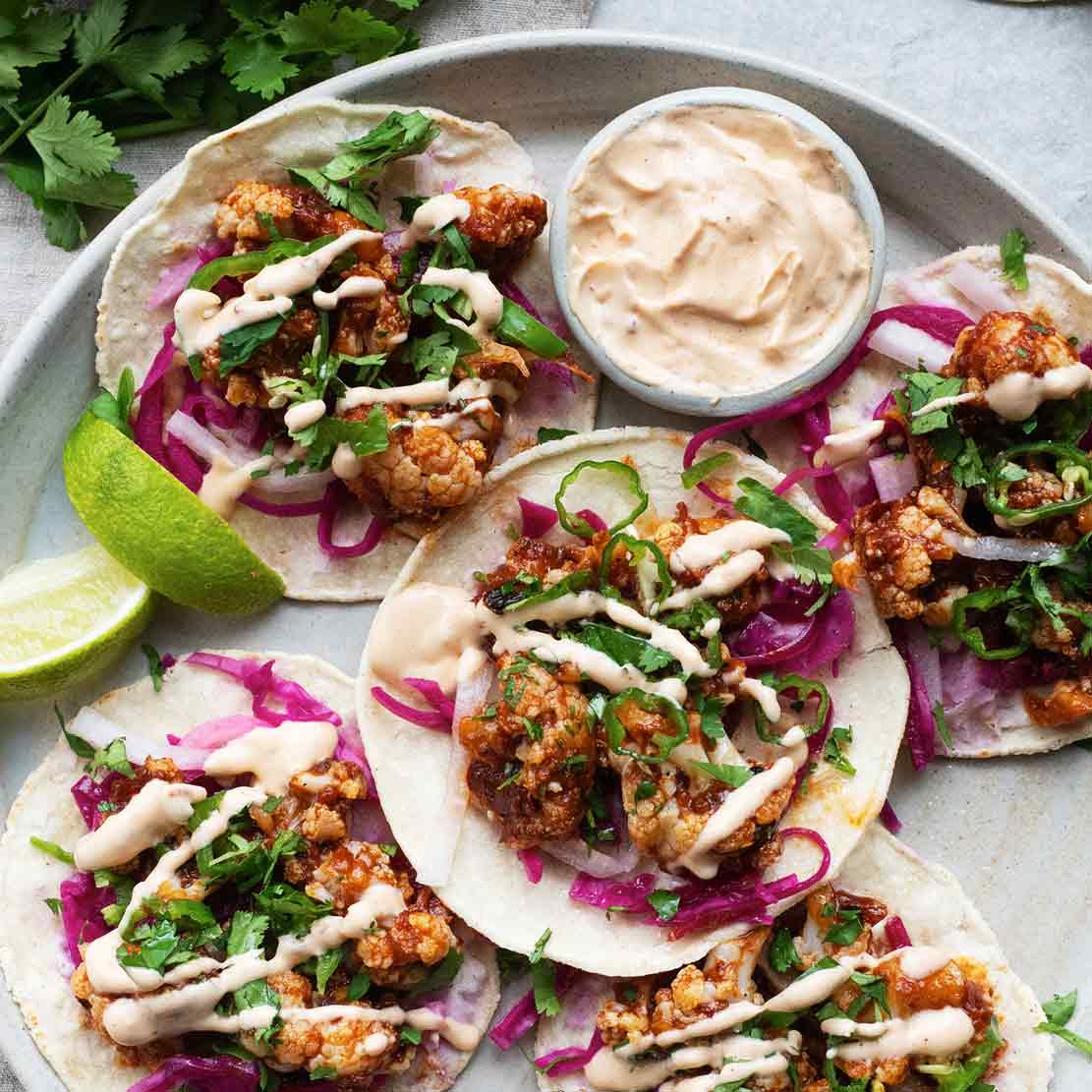 Thumbnail for Crispy Cauliflower Al Pastor Tacos With Jalapeño Salsa, Chipotle Cashew Crema, Pickled Cabbage & Lime