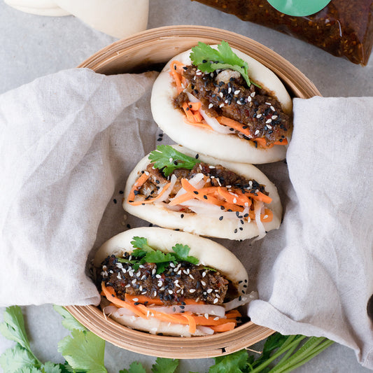 Crispy Cauliflower Baos Drenched In Tangy Five Spice Sauce With Tart Pickled Carrot & Daikon & Fresh Coriander