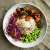 Sticky Sesame Ginger Tofu Rice Bowl With Kimchi Mayo, Pickled Cabbage, Carrot, Edamame & Sesame Seeds