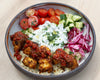 Souvlaki Style Tofu Bowl With Creamy Garlic Tzatziki, Ezme Chilli Sauce, Sumac Cabbage Onion Pickle & Fresh Salad Over Wholegrain Rice