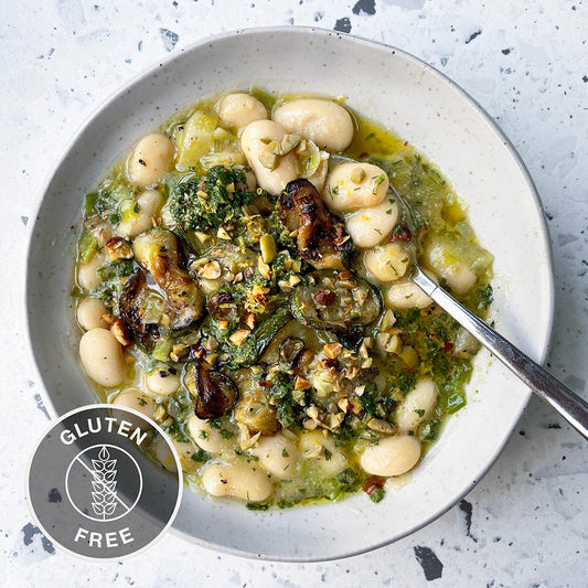 Creamy Butterbeans With Caramelised Leeks, Charred Courgettes, Drizzled With Olive & Almond Pesto