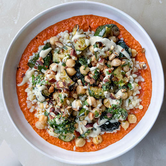 Charred Courgettes With Romesco, Chickpeas, Giant Cous Cous, Tahini Sauce & Mint Pesto