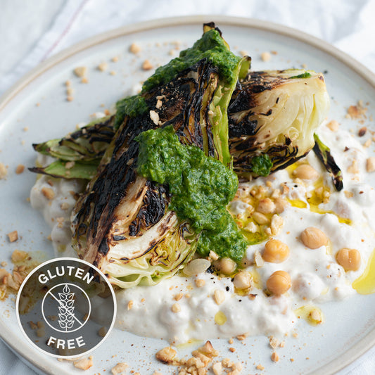 Charred Hispi Cabbage Over Chickpeas In Tahini Yoghurt, With Dukkah & Zhoug Dressing