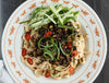 Mapo Tofu Udon Noodles In Creamy Gochujang Sauce With Fresh Cucumber Salad & Toasted Sesame Seeds
