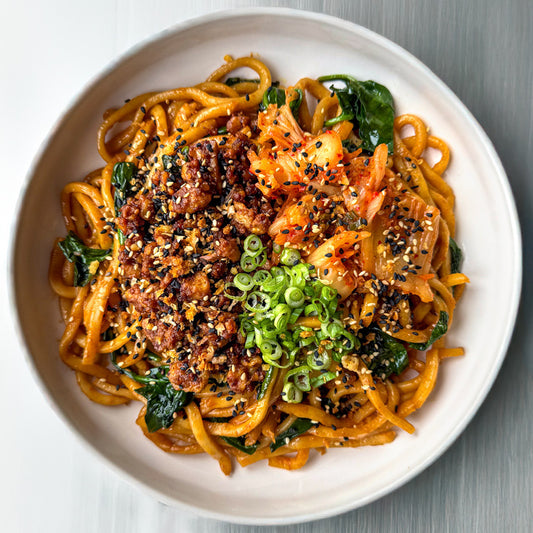 Kimchi Stir Fried Noodles With Crispy Tempeh Mince, Baby Spinach, Spring Onions & Sesame Gochugaru Crunch