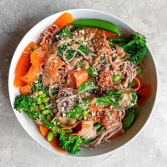 High Protein Soba Noodle Salad With Kimchi, Green Vegetable Medley, Lime Satay Sauce & Super Seed Topping