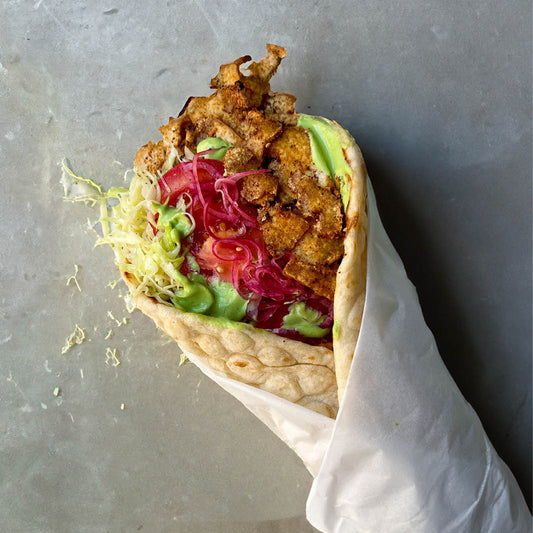 Lebanese Wrap With Crispy Spiced Tofu, Sumac Pickled Onions, Green Tahini Sauce & Fresh Salad