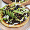 Adobo Black Bean Tostadas With Shredded Lettuce, Lime Cashew Crema, Avocado & Salsa Macha
