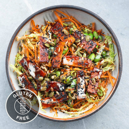 Gut-Friendly Gochujang Tempeh Over Savoy Cabbage Slaw With Fluffy Quinoa, Tahini Dressing & Omega 3 Seed Mix