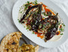 Smoky Whole Roasted Aubergine Over Creamy Whipped Tahini With Hot Agave Harissa, Fresh Parsley & Flatbreads
