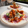 Crispy Buffalo Tofu Wrap With Creamy Cashew Blue 'Cheese' Ranch Sauce, Avocado & Rainbow Slaw